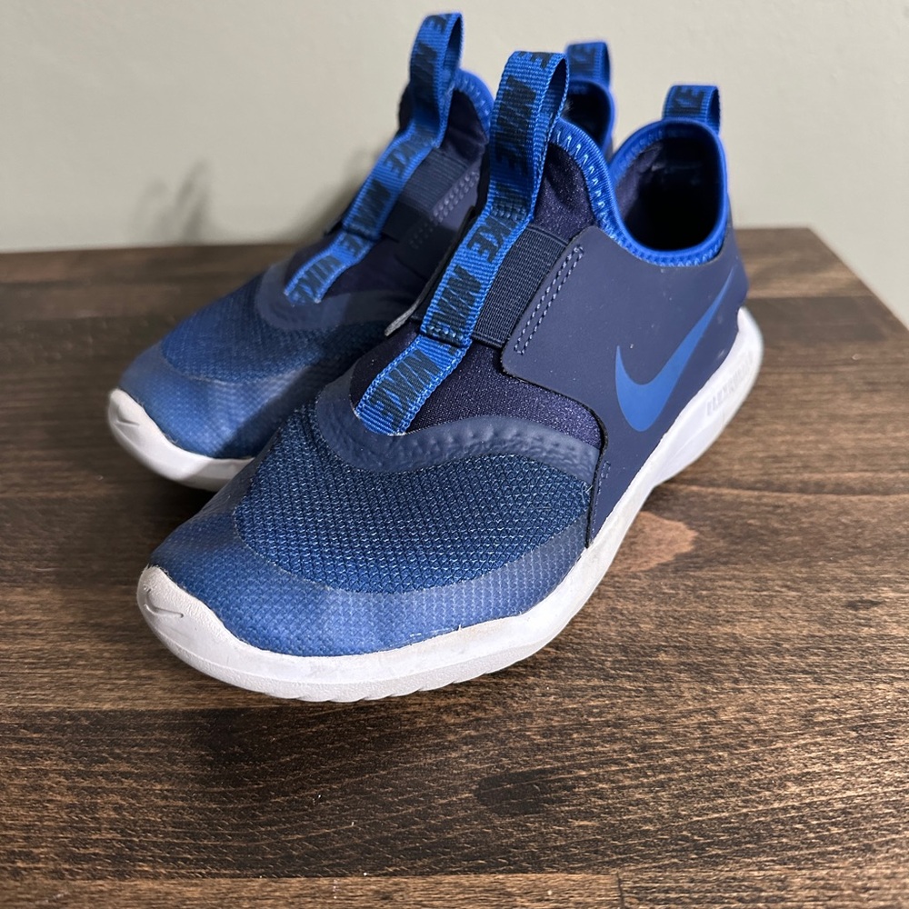 Boys blue Nike slip on shoes